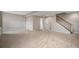 Large room featuring neutral carpeting, and a staircase leading to the upper level at 11788 Mill Valley St, Parker, CO 80138