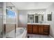 The primary bathroom features a soaking tub, glass enclosed shower and double vanity at 11788 Mill Valley St, Parker, CO 80138