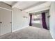 Spacious bedroom with neutral carpet, modern accents, and a large window offering plenty of natural light at 2525 S Dayton Way # 1003, Denver, CO 80231