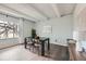 Inviting dining room features a large window for natural light and exposed beams in the ceiling at 2525 S Dayton Way # 1003, Denver, CO 80231