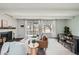 Cozy living room featuring a fireplace, hardwood floors, modern furniture, and access to a balcony at 2525 S Dayton Way # 1003, Denver, CO 80231