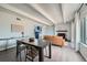 Inviting living space featuring hardwood floors, a fireplace, an open floor plan, and a modern kitchen view at 2525 S Dayton Way # 1003, Denver, CO 80231