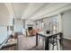 Open concept living space seamlessly connects dining and living room areas, perfect for entertaining guests at 2525 S Dayton Way # 1003, Denver, CO 80231