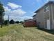 Backyard view with lush green lawn and wood fence at 2218 Coronado N Pkwy # B, Denver, CO 80229