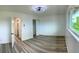 Bright bedroom with plank flooring and an open door to the closet at 2218 Coronado N Pkwy # B, Denver, CO 80229