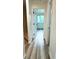 Bright hallway featuring modern flooring, fresh paint, and access to various rooms in the home at 2218 Coronado N Pkwy # B, Denver, CO 80229