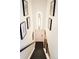 Bright staircase featuring modern light fixture and botanical wall art at 2218 Coronado N Pkwy # B, Denver, CO 80229