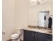 Stylish half bathroom features granite countertops and modern fixtures at 4533 Angelina Cir, Longmont, CO 80503