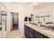 Modern bathroom with glass shower, granite countertops, and dual sinks at 4533 Angelina Cir, Longmont, CO 80503