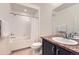 Clean bathroom featuring a bathtub, shower, vanity with a mirror, and neutral color palette at 4533 Angelina Cir, Longmont, CO 80503