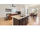 Open-concept kitchen island featuring granite countertops and stainless steel appliances at 4533 Angelina Cir, Longmont, CO 80503