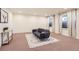 Spacious living room with neutral tones, modern decor, and plenty of natural light from the windows at 4533 Angelina Cir, Longmont, CO 80503