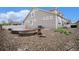 Backyard showcasing a stone patio, gravel landscaping, and a well-maintained exterior at 5521 Ensenada St, Denver, CO 80249