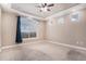Bedroom featuring neutral paint, carpeted floors, and recessed ceiling at 5521 Ensenada St, Denver, CO 80249