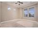 Bedroom featuring natural light, neutral paint, and carpeted floor at 5521 Ensenada St, Denver, CO 80249