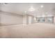 Large bonus room featuring neutral carpet, recessed lighting, and ample natural light at 5521 Ensenada St, Denver, CO 80249