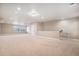 Spacious bonus room featuring neutral carpet, natural light and recessed lighting at 5521 Ensenada St, Denver, CO 80249