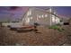 Backyard showcasing a stone patio, gravel landscaping, and a well-maintained exterior at 5521 Ensenada St, Denver, CO 80249
