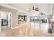 Open concept living space featuring a sleek kitchen and plenty of natural light throughout at 5521 Ensenada St, Denver, CO 80249