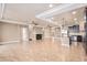 Spacious open living space featuring modern finishes and an open layout to the kitchen at 5521 Ensenada St, Denver, CO 80249