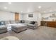 Finished basement with comfortable seating, a wet bar, and a modern design for relaxation and entertainment at 43 Falcon Hills Dr, Highlands Ranch, CO 80126