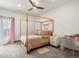 bedroom with a canopy bed, carpet floors and a small desk area at 43 Falcon Hills Dr, Highlands Ranch, CO 80126