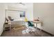 bedroom with a canopy bed, carpet floors and a small desk area at 43 Falcon Hills Dr, Highlands Ranch, CO 80126
