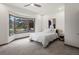 Bright bedroom with natural light from the large window and neutral tones creating a peaceful ambiance at 43 Falcon Hills Dr, Highlands Ranch, CO 80126