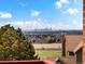 Enjoy panoramic views of the city skyline from this home, set against a backdrop of mature trees at 43 Falcon Hills Dr, Highlands Ranch, CO 80126
