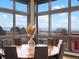 Bright dining area featuring large windows with scenic views and a stylish round table at 43 Falcon Hills Dr, Highlands Ranch, CO 80126