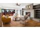 Bright living room with a fireplace, lots of natural light, and sliding doors to the outdoor deck at 43 Falcon Hills Dr, Highlands Ranch, CO 80126