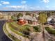 Expansive backyard featuring lush landscaping, a spacious deck, and mature trees creating a private oasis at 43 Falcon Hills Dr, Highlands Ranch, CO 80126