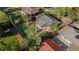 An aerial view of a well-maintained property, surrounded by mature trees and a green lawn at 1269 N Revere St, Aurora, CO 80011