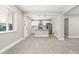 Clean and open kitchen featuring a center island, stainless steel appliances, and modern pendant lights at 1269 N Revere St, Aurora, CO 80011