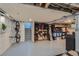 Unfinished basement with exposed ceiling, ready for customization, and includes storage for bikes and snowboards at 3259 Lowell Blvd, Denver, CO 80211