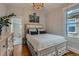 Comfortable bedroom showcasing hardwood floors, closet, neutral walls, and chandelier at 3259 Lowell Blvd, Denver, CO 80211