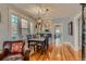 Bright dining room with hardwood floors, modern light fixture, and open access to the kitchen, great for entertaining at 3259 Lowell Blvd, Denver, CO 80211