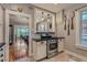 Charming kitchen featuring stainless steel appliances, granite counters, and decorative wall art at 3259 Lowell Blvd, Denver, CO 80211