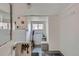 Bright mud room with white shiplap walls, storage bench, and convenient hooks for coats and keys at 3259 Lowell Blvd, Denver, CO 80211