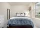 Comfortable bedroom featuring a plush bed, soft lighting, and tranquil decor at 9723 Bennett Peak St, Littleton, CO 80125