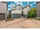 Inviting home exterior with brick driveway and an attached two-car garage at 9723 Bennett Peak St, Littleton, CO 80125