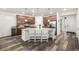 Open kitchen with island, granite counters, stainless appliances, and generous cabinet space at 9723 Bennett Peak St, Littleton, CO 80125