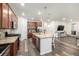 Kitchen with stainless appliances, island, and direct views to the living area at 9723 Bennett Peak St, Littleton, CO 80125