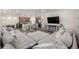 Spacious open-concept living room with modern floors, connecting the kitchen and dining areas at 9723 Bennett Peak St, Littleton, CO 80125