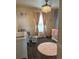 Cozy Bedroom with comfortable seating, chandelier lighting, and a cute crib and changing table at 19102 E Hampden Dr, Aurora, CO 80013