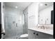 Bathroom featuring white marble walk-in shower and vanity with marble countertop at 3309 E 7Th Ave Pkwy, Denver, CO 80206