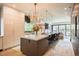 Modern kitchen featuring a large island with seating, sleek cabinetry, and stainless steel appliances at 3309 E 7Th Ave Pkwy, Denver, CO 80206