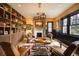 Cozy living room featuring a fireplace, built-in bookshelves, comfortable seating, and natural light at 3309 E 7Th Ave Pkwy, Denver, CO 80206