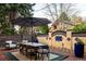 Outdoor patio featuring dining table with seating and a decorative brick wall at 3309 E 7Th Ave Pkwy, Denver, CO 80206