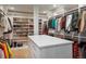 Organized walk-in closet with ample shelving, drawers, and hanging space for clothes and shoes at 3309 E 7Th Ave Pkwy, Denver, CO 80206